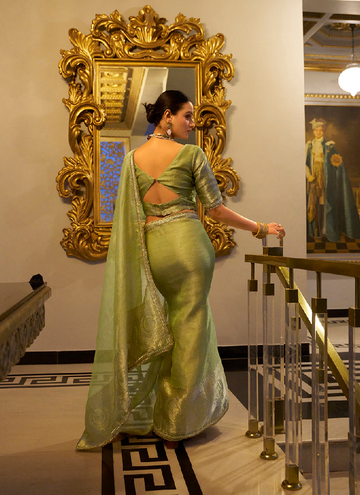 Classic Pista green TIssue shimmer saree with zari weaving and sequin lace.